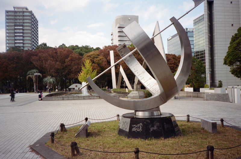 A photo of an art piece in a paved park
